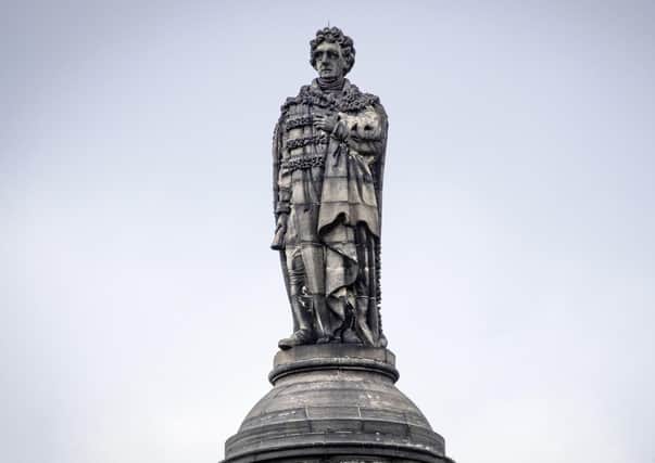 The statue of Henry Dundas 1st Viscount Melville on top of a 150ft column, known as the Melville Monument, stands in St Andrew Square, Edinburgh.