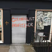 An empty shop was graffitied because it was on Dundas Street (Picture: Lisa Ferguson)