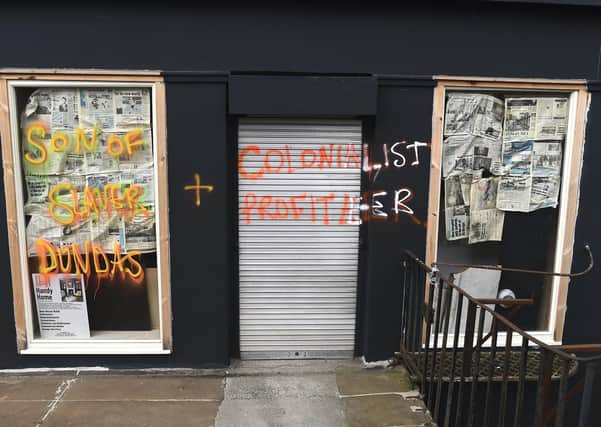 An empty shop was graffitied because it was on Dundas Street (Picture: Lisa Ferguson)