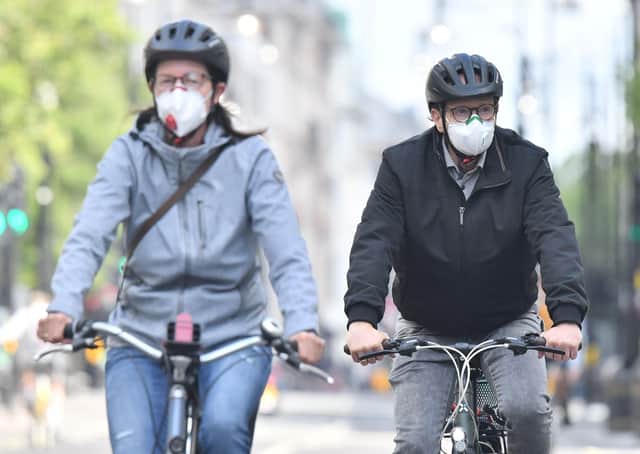 Many Scots have acquired a taste for cycling during lockdown, but if this active travel revolution is to be sustained road space will need to be reallocated for safety reasons (Picture: Justin Tallis/AFP via Getty Images)