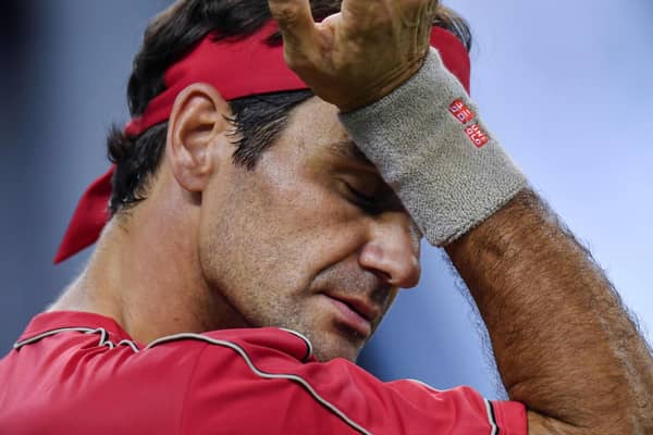 Men's Grand Slam singles record-holder Roger Federer said he would be sidelined until 2021 after undergoing keyhole surgery on his right knee. Picture: Hector Retamal/AFP via Getty Images
