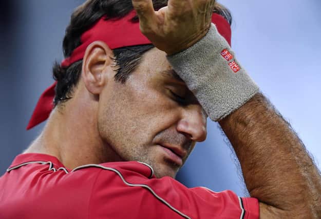 Men's Grand Slam singles record-holder Roger Federer said he would be sidelined until 2021 after undergoing keyhole surgery on his right knee. Picture: Hector Retamal/AFP via Getty Images