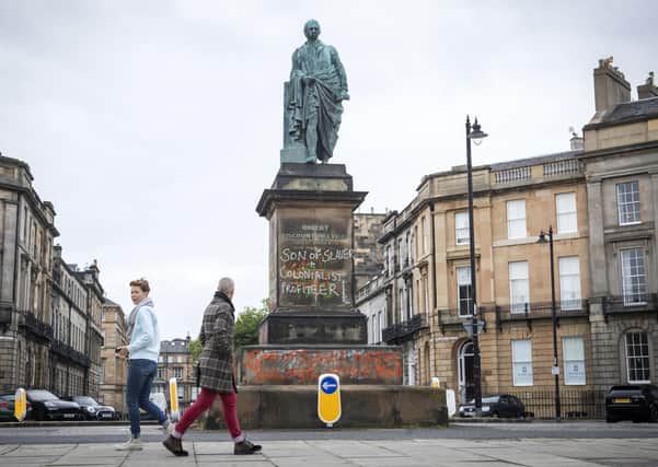 Graffiti that reads "Son of slaver and Colonialist Profiteer" has appeared on the statue of Robert Dundas, 2nd Viscount Melville, son of Henry Dundas 1st Viscount Melville, on Melville Street in Edinburgh. Picture: Jane Barlow/PA Wire