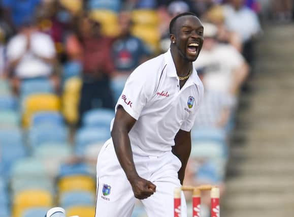 West Indies bowler Kemar Roach celebrates the dismissal of England's Jos Buttler during the first Test in Barbados in January 2019. Picture: Randy Brooks/AFP via Getty Images