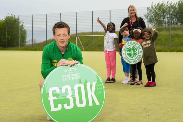 Callum McGregor with St Teresa’s Primary School head teacher Lesley Fee and children from local schools as Celtic make a £30,000 donation to 12 local schools and nurseries as part of their Football For Good Fund. Picture: SNS