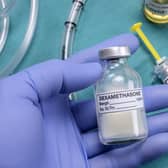 A nurse prepares for medical treatment with dexamethasone in a UK hospital
