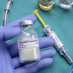 A nurse prepares for medical treatment with dexamethasone in a UK hospital