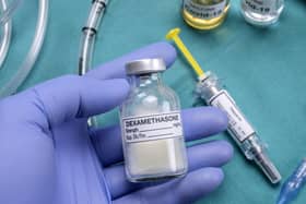 A nurse prepares for medical treatment with dexamethasone in a UK hospital