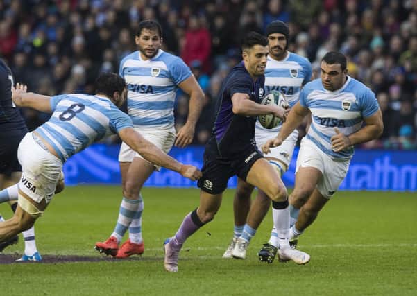 Adam Hastings bursts through the Argentina defence during the autumn Test in 2018. The SRU are hoping that this November’s match against the Pumas can still go ahead with fans in attendance. Picture: SNS