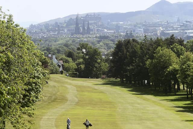 A couple of golfers respecting the lockdown two-ball limit and the two-metre social distancing rule as they play at Murrayfield GC. Picture: Lisa Ferguson