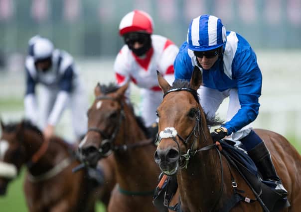Jim Crowley rides Battaash, right, to victory in The King's Stand Stakes. Picture: Edward Whitaker/AFP