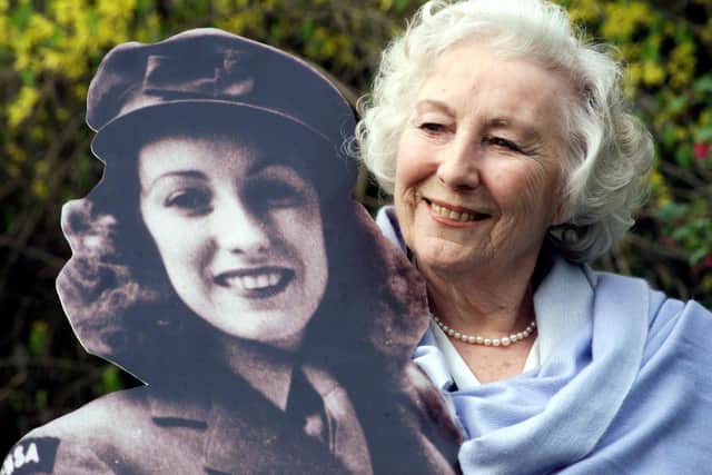 Dame Vera Lynn poses with a cardboard cut out of her younger self in 2000 (Picture: Sean Dempsey/PA Wire)