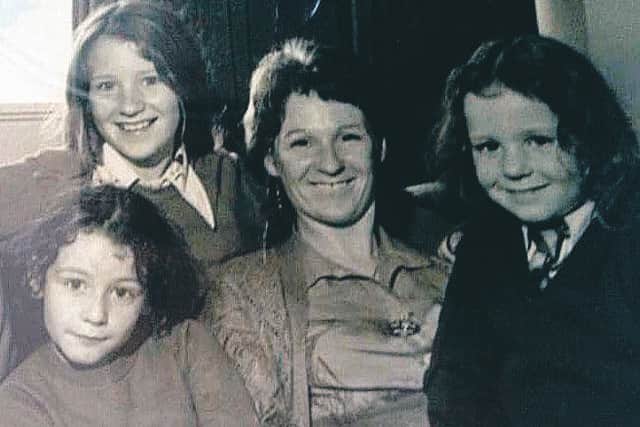 Heather Black in a family photograph with her daughters, from left, Sarah, Victoria and Zoe