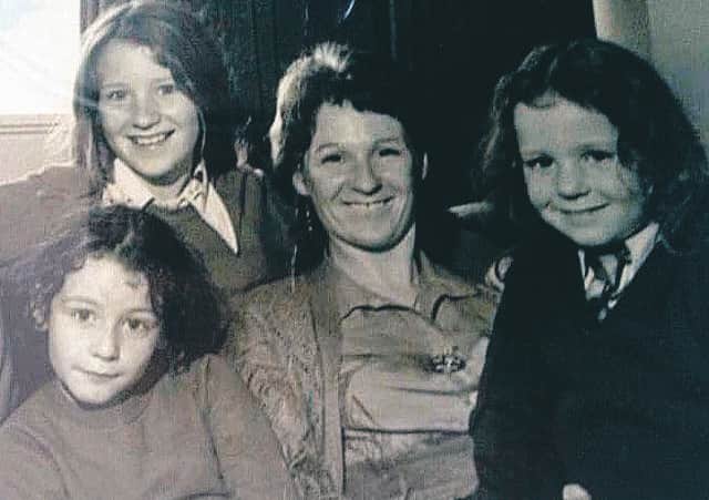Heather Black in a family photograph with her daughters, from left, Sarah, Victoria and Zoe