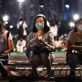 Activists hold a candlelit remembrance in Victoria Park in Hong Kong for the victims of the 1989 Tiananmen Square crackdown (Picture: Anthony Wallace/AFP via Getty Images)