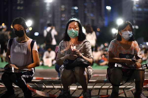 Activists hold a candlelit remembrance in Victoria Park in Hong Kong for the victims of the 1989 Tiananmen Square crackdown (Picture: Anthony Wallace/AFP via Getty Images)