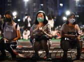Activists hold a candlelit remembrance in Victoria Park in Hong Kong for the victims of the 1989 Tiananmen Square crackdown (Picture: Anthony Wallace/AFP via Getty Images)