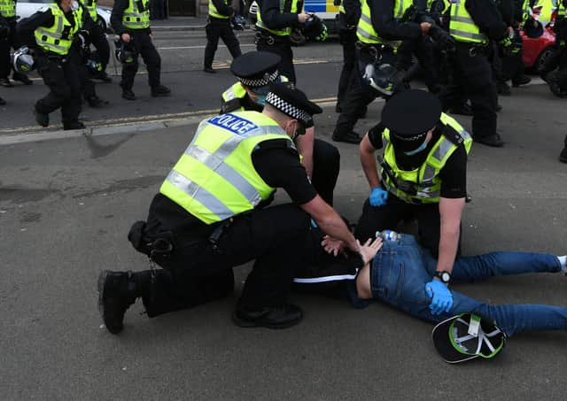 Police make an arrest after far-right groups moved into Glasgow's George Square to disrupt a peaceful protest (Picture: John Devlin)