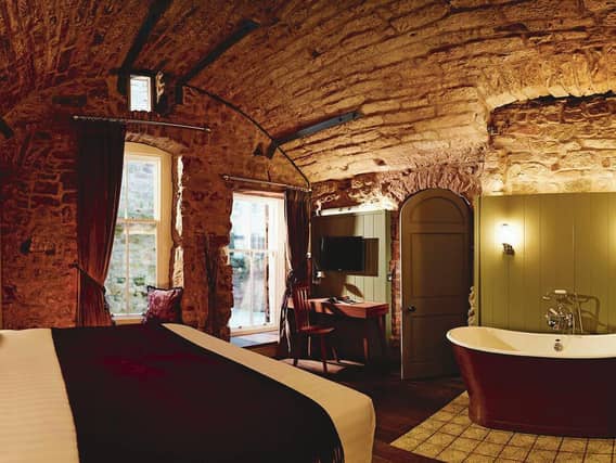 Exposed stone makes for a unique interior in Old Town Chambers' 15th century townhouse apartment, one of 50 serviced apartments comprising studios, one, two and three-bedroom apartments, as well as three penthouses and the townhouse