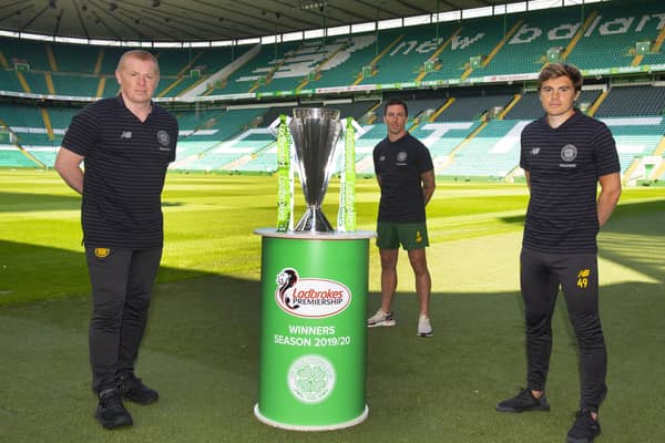 Celtic manager Neil Lennon and players Scott Brown and James Forrest with the Premiership trophy. Picture: SNS