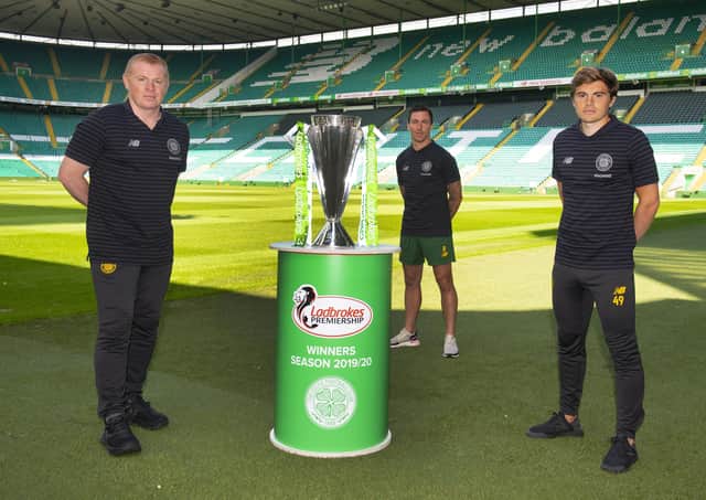 Celtic manager Neil Lennon and players Scott Brown and James Forrest with the Premiership trophy. Picture: SNS