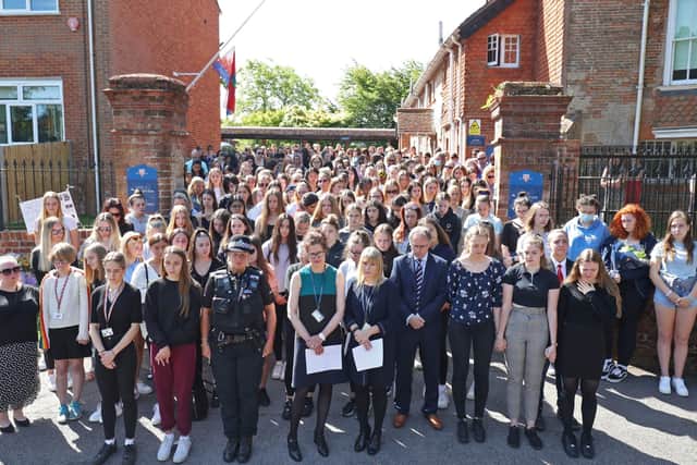 Colleagues and pupils of teacher James Furlong take part in a period of silence at the Holt School, Wokingham, Berskhire. Picture: Steve Parsons/PA Wire