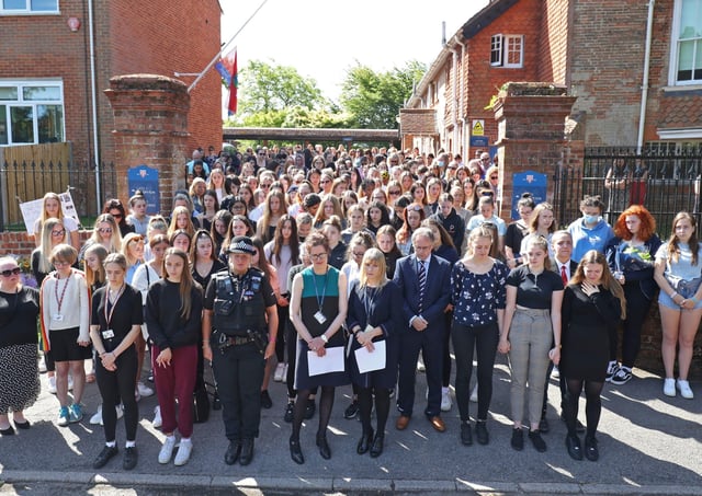 Colleagues and pupils of teacher James Furlong take part in a period of silence at the Holt School, Wokingham, Berskhire. Picture: Steve Parsons/PA Wire