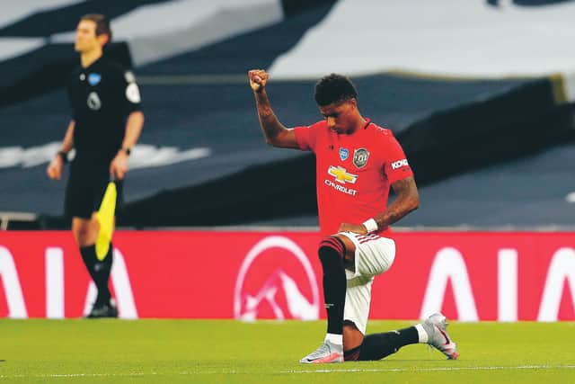 Manchester United striker Marcus Rashford supports the Black Lives Matter movement before Friday’s game at Tottenham. Photograph: Matt Childs/Getty