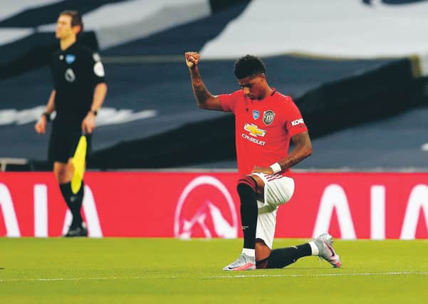 Manchester United striker Marcus Rashford supports the Black Lives Matter movement before Friday’s game at Tottenham.  Photograph: Matt Childs/Getty