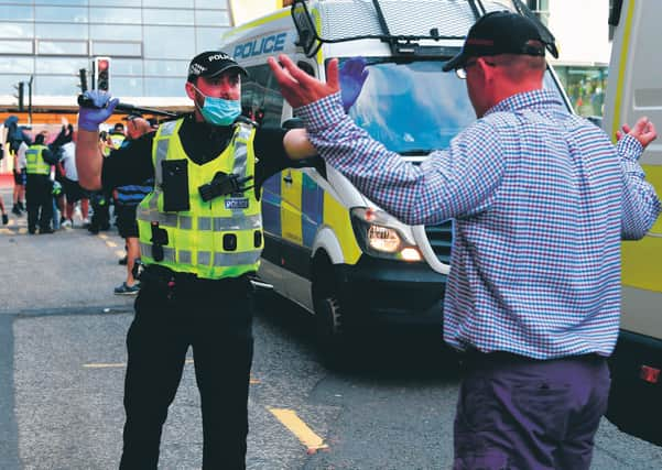 A tense stand-off during Wednesday's troubles in George Square. Picture: John Devlin