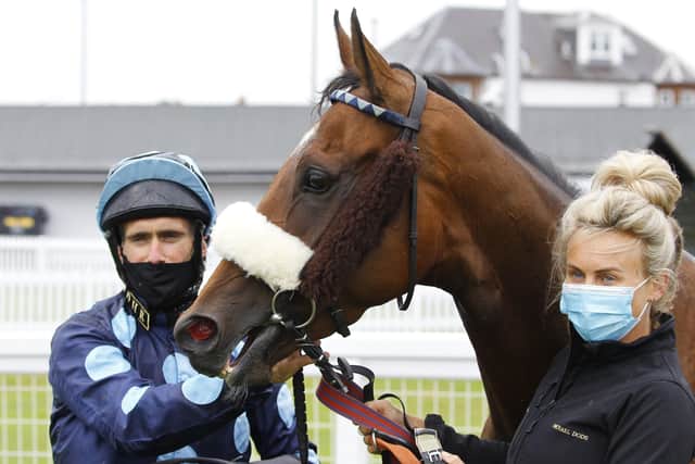 Que Amoro and jockey Paul Mulrennan, left, after winning the EBF Land Of Burns Fillies Stakes at Ayr Racecourse. Picture: Steve Davies/PA Wire