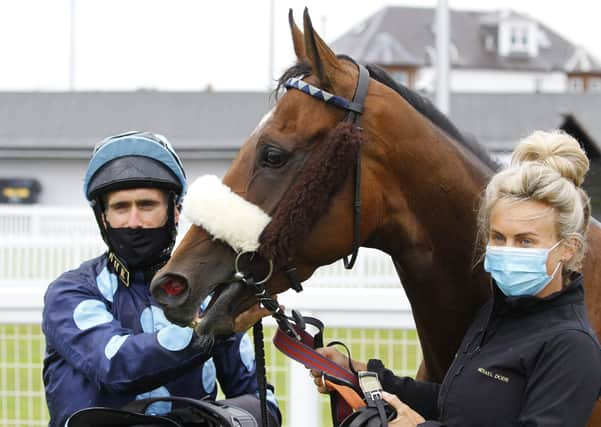 Que Amoro and jockey Paul Mulrennan, left, after winning the EBF Land Of Burns Fillies Stakes at Ayr Racecourse. Picture: Steve Davies/PA Wire