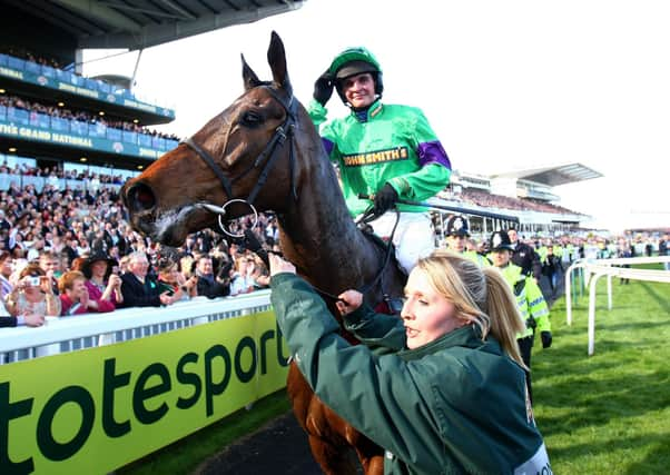 Mon Mome and jockey Liam Treadwell celebrate winning the 2009 John Smith’s Grand National. Picture: David Davies/PA Wire