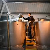 Kingsbarns distillery manager Peter Holroyd takes a dip and gravity test from the washback in St Andrews, Scotland. Picture: Jeff J Mitchell/Getty Images