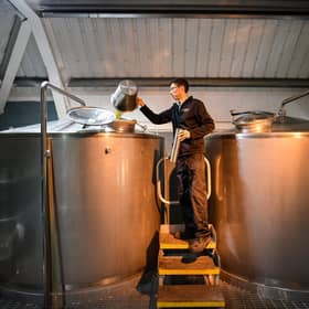 Kingsbarns distillery manager Peter Holroyd takes a dip and gravity test from the washback in St Andrews, Scotland. Picture: Jeff J Mitchell/Getty Images