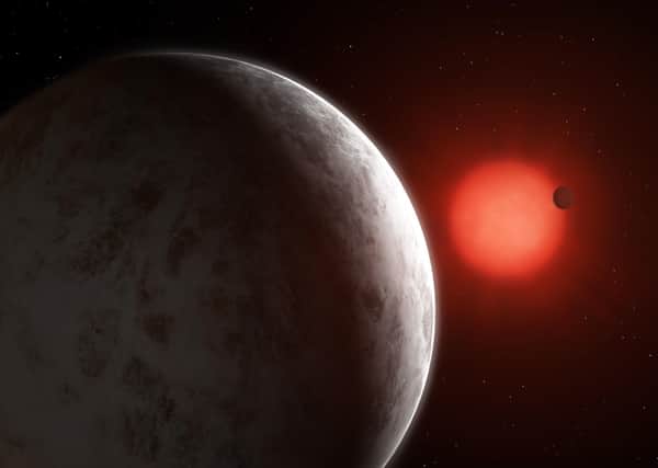 An artist's impression of the two "super-earths" that have been discovered orbiting one of the brightest red dwarf stars in the sky. Picture: Mark Garlick/PA Wire