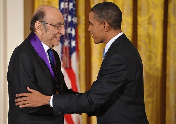 US President Barack Obama shakes hands with graphic designer Milton Glaser after presenting him with the 2009 National Medal of Arts during a ceremony February 25, 2010 (Picture:  MANDEL NGAN/AFP via Getty Images)