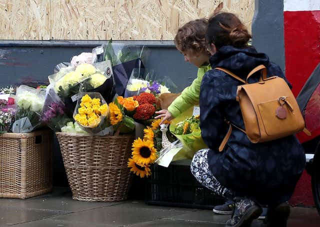 Flowers are laid at the scene in Morningside Road, Edinburgh, where a car crashed, killing a three-year-old boy (Picture: Jane Barlow/PA Wire)