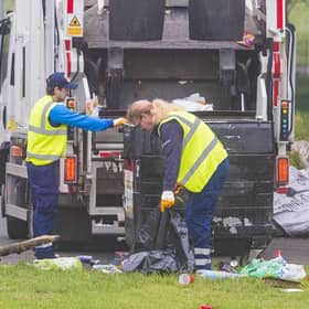 Edinburgh City Council employees clear up a large amount of waste left discarded in the Meadows last month