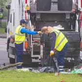 Edinburgh City Council employees clear up a large amount of waste left discarded in the Meadows last month