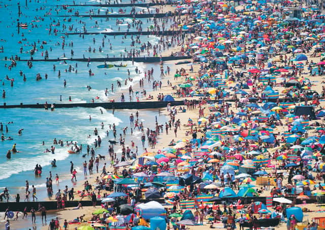There is more alarm at the UK's overcrowded beaches than at financial meltdown. Picture: Finnbarr Webster/Getty