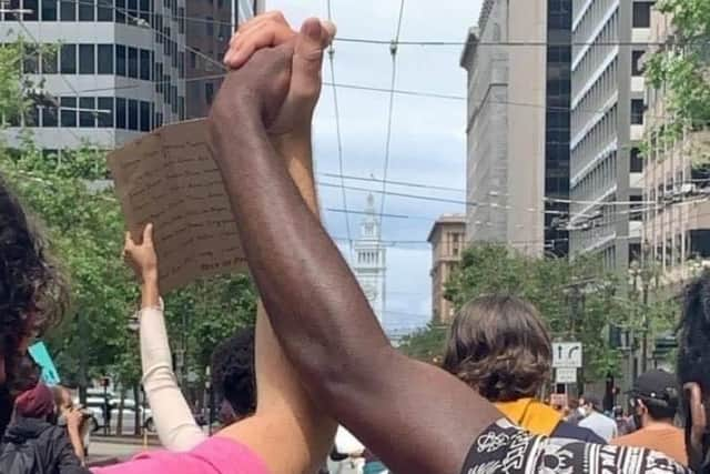 Corey and Daniel Hastings link arms during a Black Lives Matter protest on the streets of San Francisco at the end of last month.