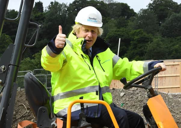 Britain's Prime Minister Boris Johnson visits the Speller Metcalfe's building site at The Dudley Institute of Technology in Dudley