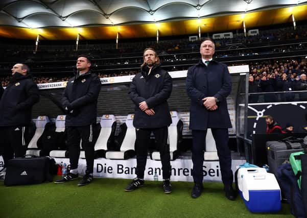 Austin MacPhee, third left, stands alongside Michael O’Neill with whom he worked in the Northern Ireland set-up. Picture: James Marsh/BPI/Shutterstock