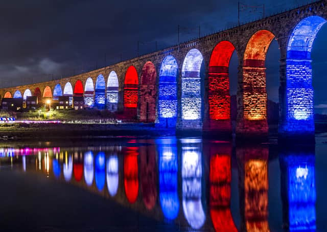 The Royal Border Bridge, illuminated in red, white and blue, enable people to travel across a border that may or may not exist, depending on your point of view (Picture: Jane Barlow)