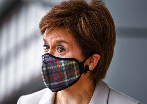 If Nicola Sturgeon can wear a face mask then you can too (Picture: Jeff J Mitchell /PA Wire)