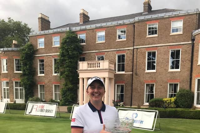 A happy Gemma Dryburgh shows off her trophy after a one-shot success at The Buckinghamshire