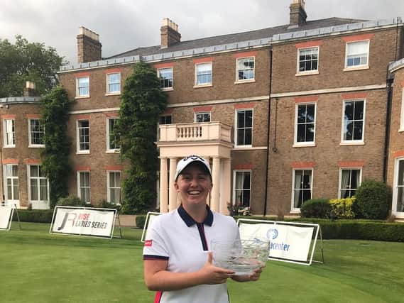 A happy Gemma Dryburgh shows off her trophy after a one-shot success at The Buckinghamshire