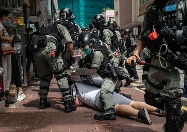 A man is detained by riot police during a demonstration in Hong Kong. Picture: Anthony Kwan/Getty Images