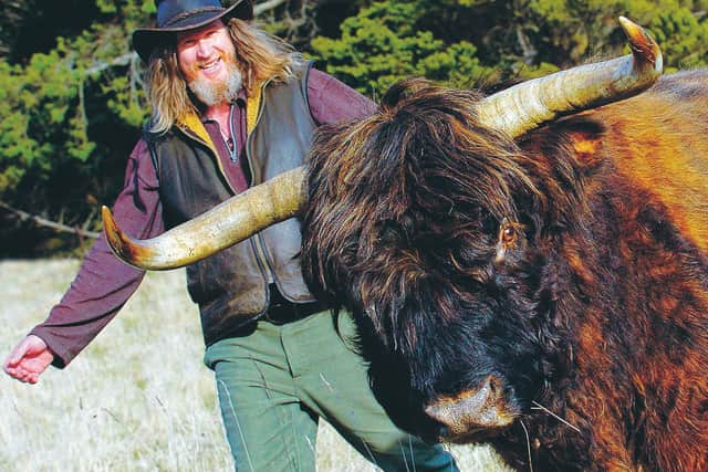 Blackmount organic farmer Tim Gow and Hairy Maclary the western Highlander on their Mangapiri Downs station